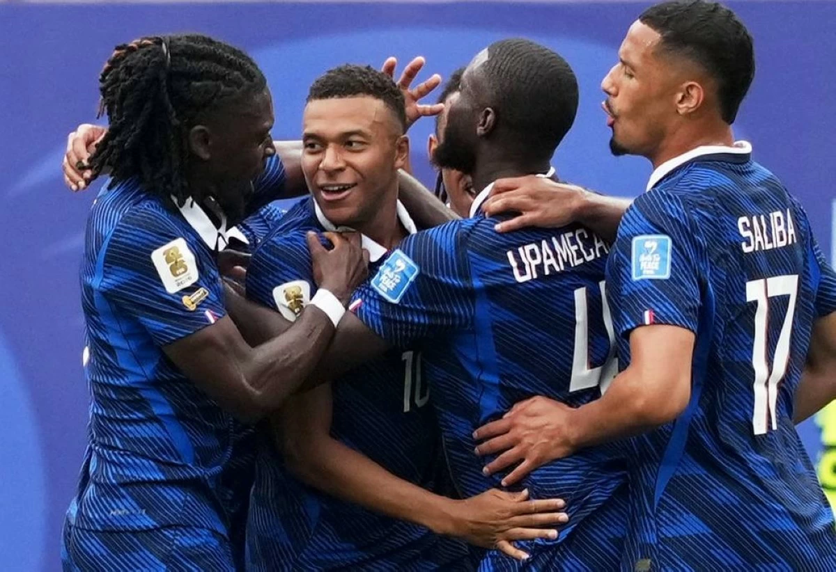 France's Kylian Mbappe celebrates scoring their first goal with teammates during the France v Iraq match. Picture credit: Reuters