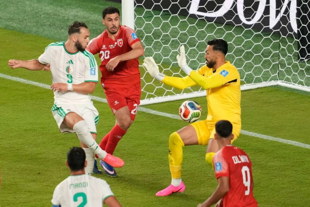 Algeria's Amine Gouiri (9) scores a goal past Jordan goalkeeper Yazeed Abulaila (1) during the World Cup Group J soccer match between Jordan and Algeria in Santa Clara, Calif., near San Francisco, Monday, June 22, 2026. (AP)