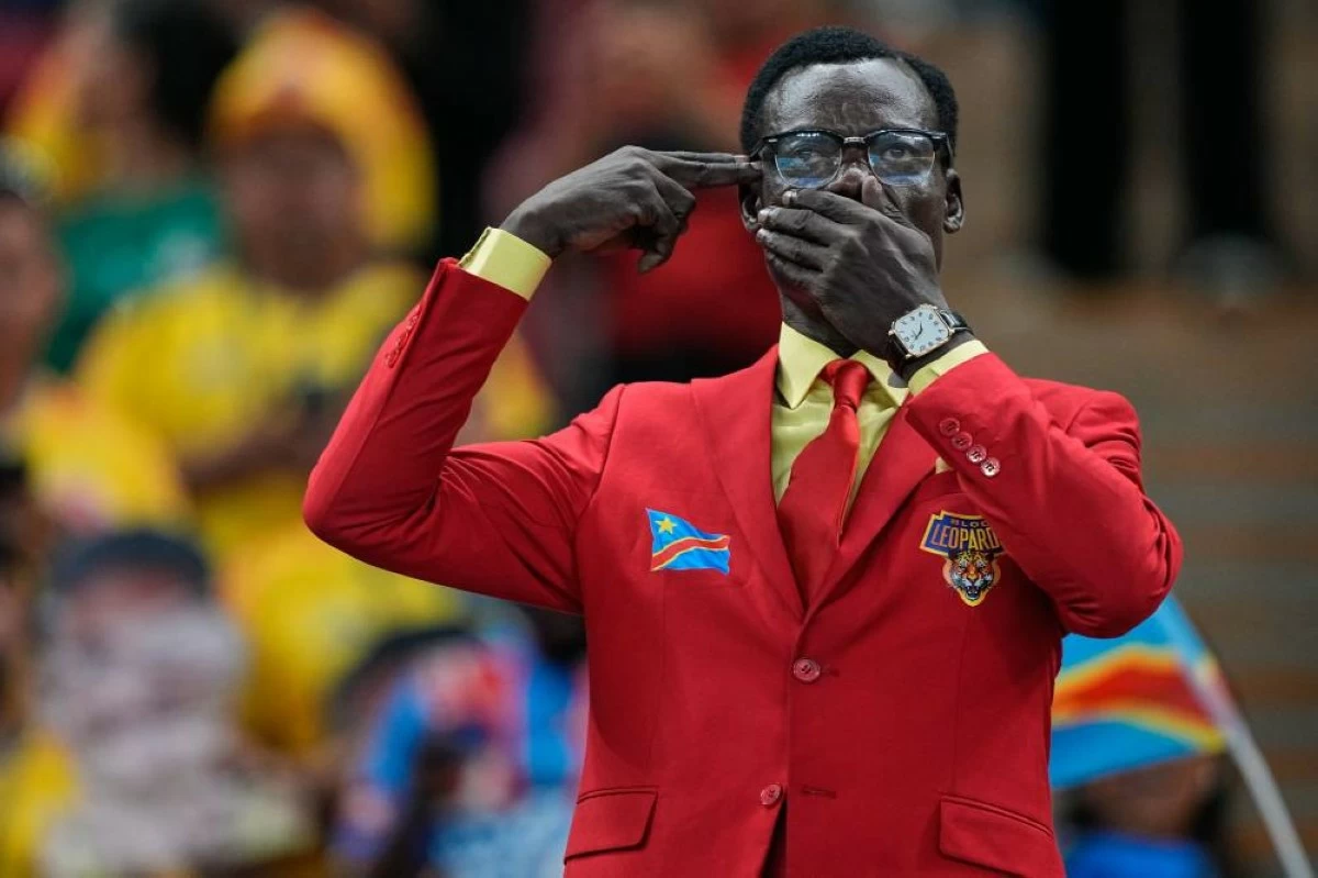 Congo supporter Michel Nkuka Mboladinga, poses dressed as the country's assassinated independence hero Patrice Lumumba, reacts ahead of the World Cup Group K soccer match between Colombia and Congo in Zapopan, near Guadalajara, Mexico, Tuesday, June 23, 2026. (AP Photo/Natacha Pisarenko)