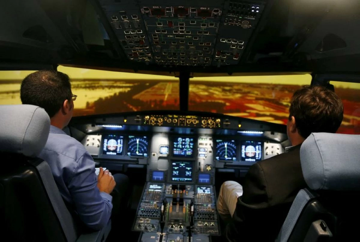 Guests prepare for landing in an A320 flight simulator during a tour of the new Airbus Asia Training Centre in Singapore April 18, 2016. Reuters file photo used for illustrative purposes only.
