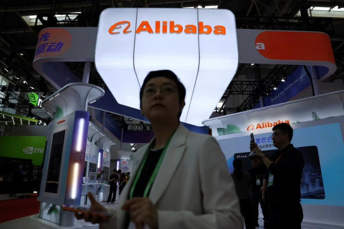 People walk past the Alibaba booth during the China International Supply Chain Expo (CISCE) in Beijing, China June 22, 2026. (Reuters)