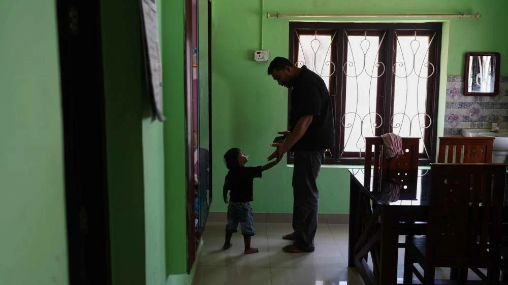 Safeer Mohammed Koorimannil plays with his nephew, Tahan Tabis, at their house in Sulthan Bathery in the southern state of Kerala, India, Thursday, March 12, 2026, after he said he paid more than $5,000 to be freed from a scam compound in Myanmar where he was trafficked. (AP)