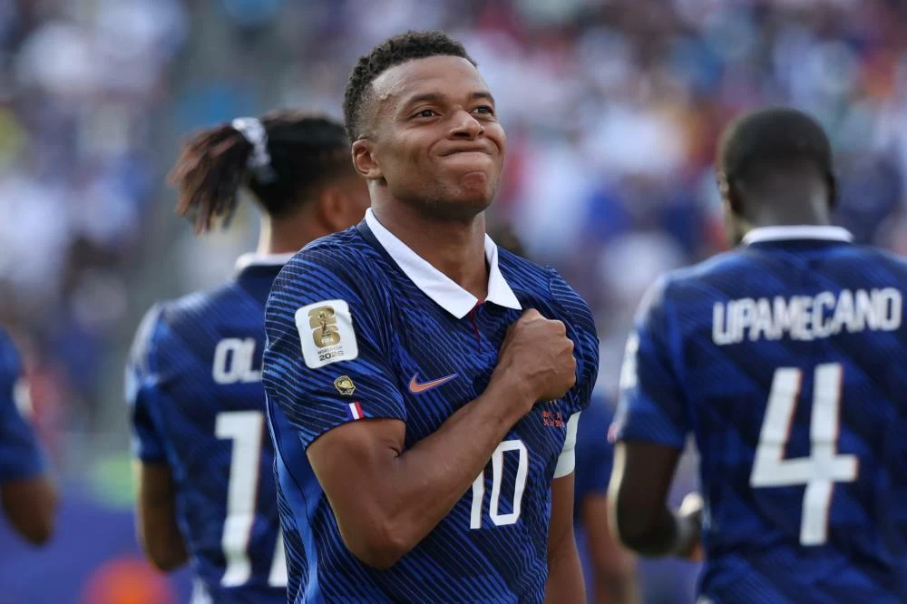 France's Kylian Mbappe (10) celebrates scoring their third goal during the World Cup round of 32 soccer match between France and Sweden in East Rutherford, N.J. Picture credit: AP