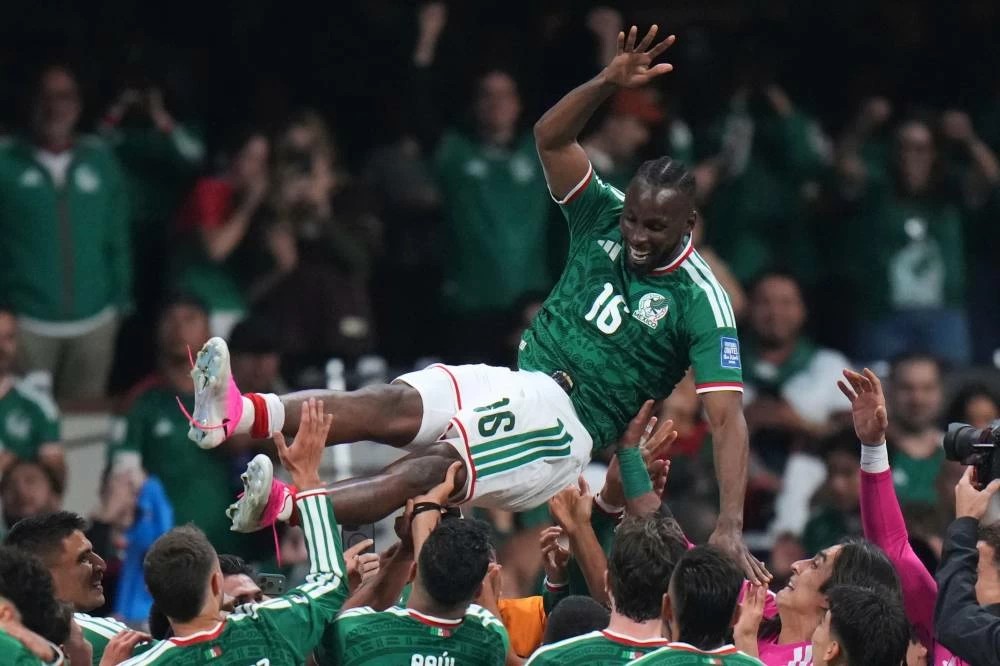 Mexico's Julian Quinones (16) is lifted in the air as he celebrates his team victory with his teammates during the World Cup round of 32 soccer match between Mexico and Ecuador in Mexico City, Tuesday, June 30, 2026. (AP Photo/Eduardo Verdugo)