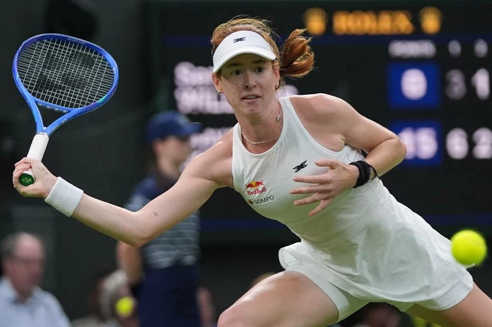 Maya Joint of Australia returns the ball to Serena Williams of the United States in their first-round women's singles match at the Wimbledon Tennis Championships in London, Tuesday, June 30, 2026. (AP Photo/Maja Smiejkowska)
