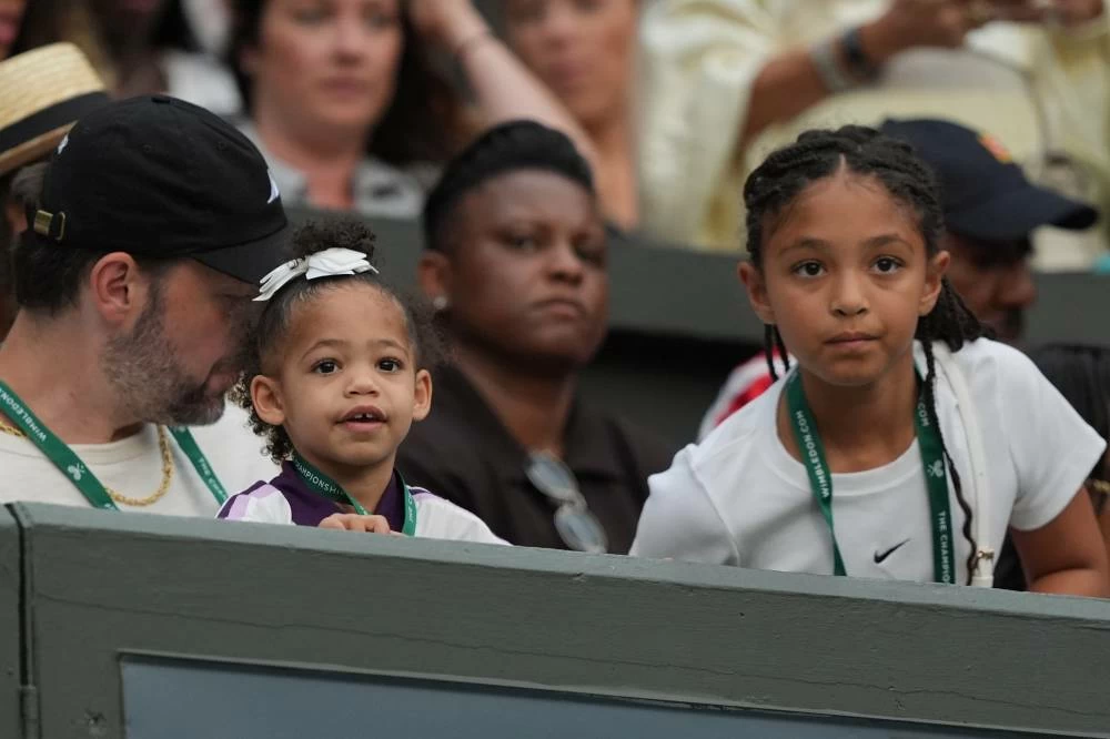 Serena's William husband Alexis Ohanian and their daughters Olympia and Adira watch the first-round women's singles match between Serena Williams of the United States and Maya Joint of Australia, at the Wimbledon Tennis Championships in London, Tuesday, June 30, 2026. (AP)