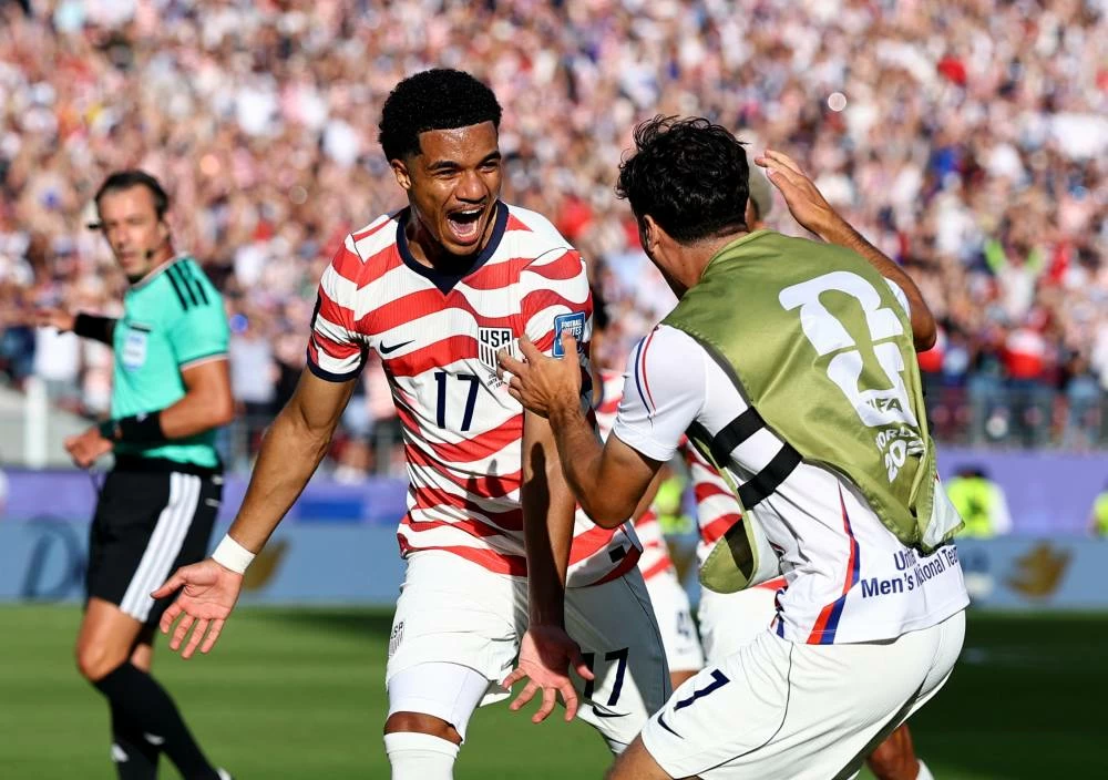 Malik Tillman of the U.S. celebrates scoring their second goal with Giovanni Reyna. Picture credit: Reuters