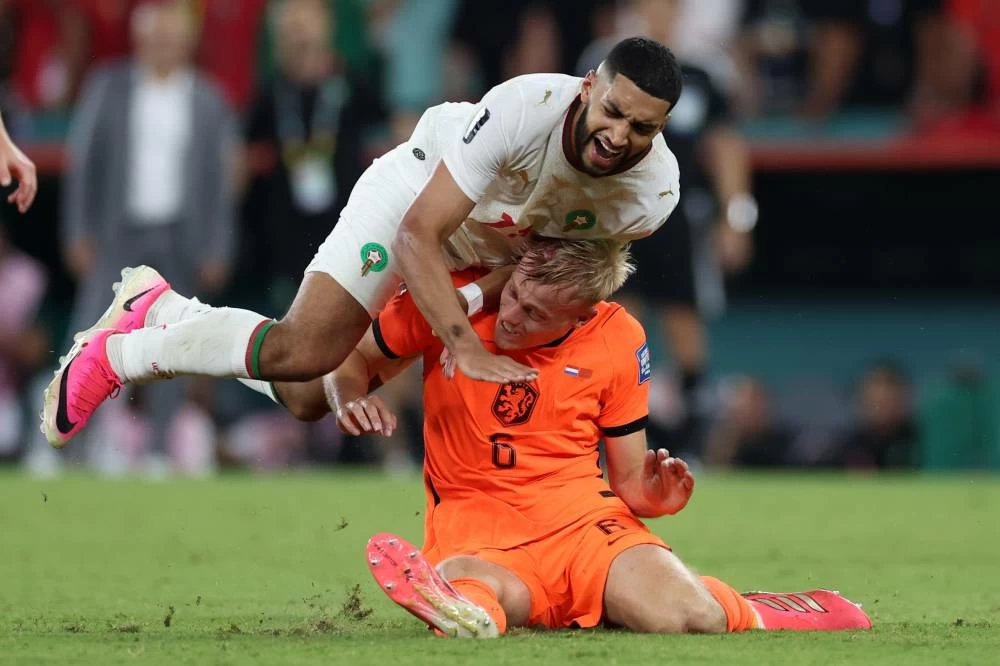Morocco's Ismael Saibari (11) falls over Netherlands' Jan Paul van Hecke (6) during the World Cup round of 32 soccer match between the Netherlands and Morocco in Guadalupe, near Monterrey, Mexico, Monday, June 29, 2026. (AP)