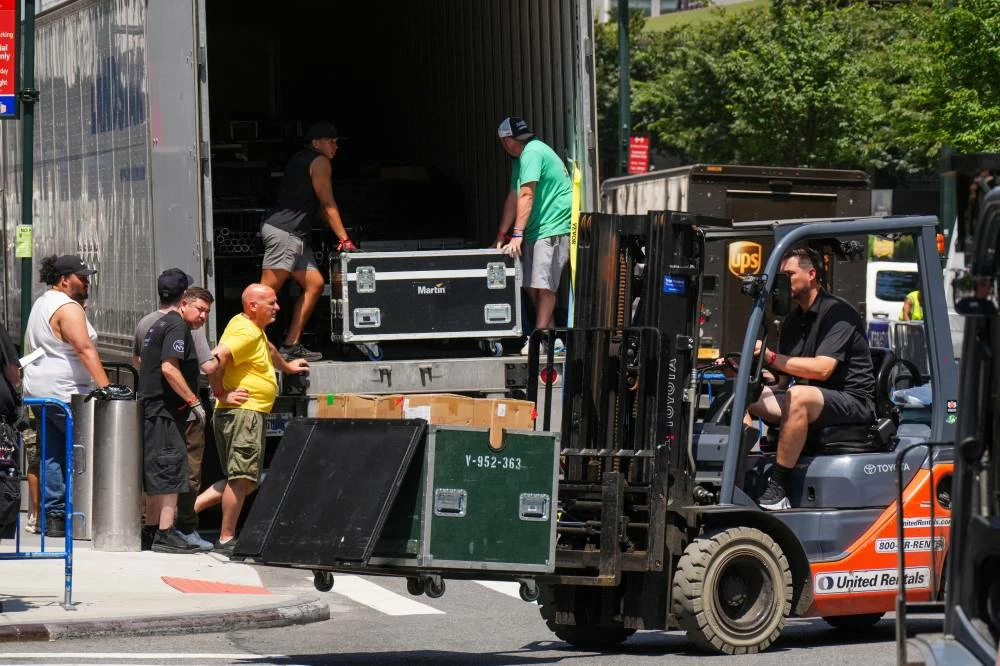Workers unload items from trucks at Madison Square Garden, ahead of a reported wedding between Taylor Swift and Travis Kelce, in New York City, U.S., July 1, 2026. REUTERS