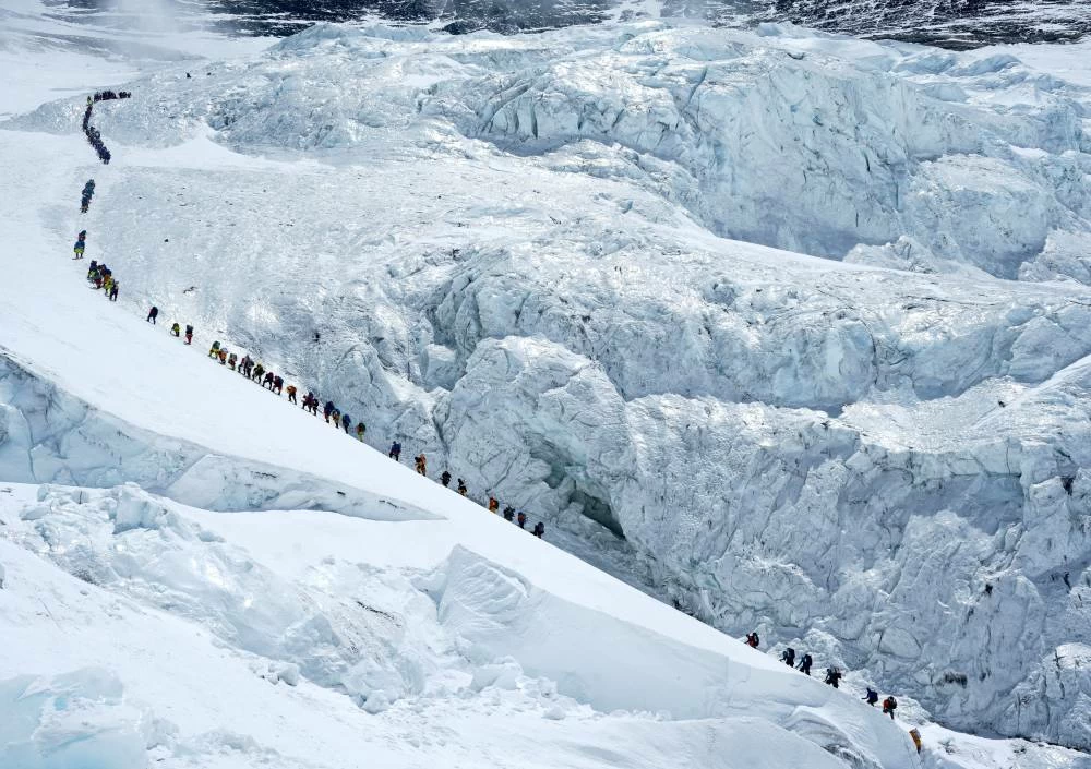 Climbers walk in a long queue as they head to summit Mount Everest. File photo for illustrative purposes only. (Reuters)