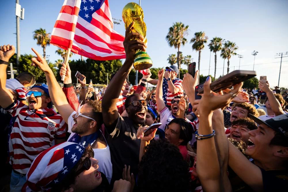 Fans celebrate after the U.S. defeated Bosnia during a watch party for a World Cup Round of 32 soccer match between the United States and Bosnia. Picture credit: AP