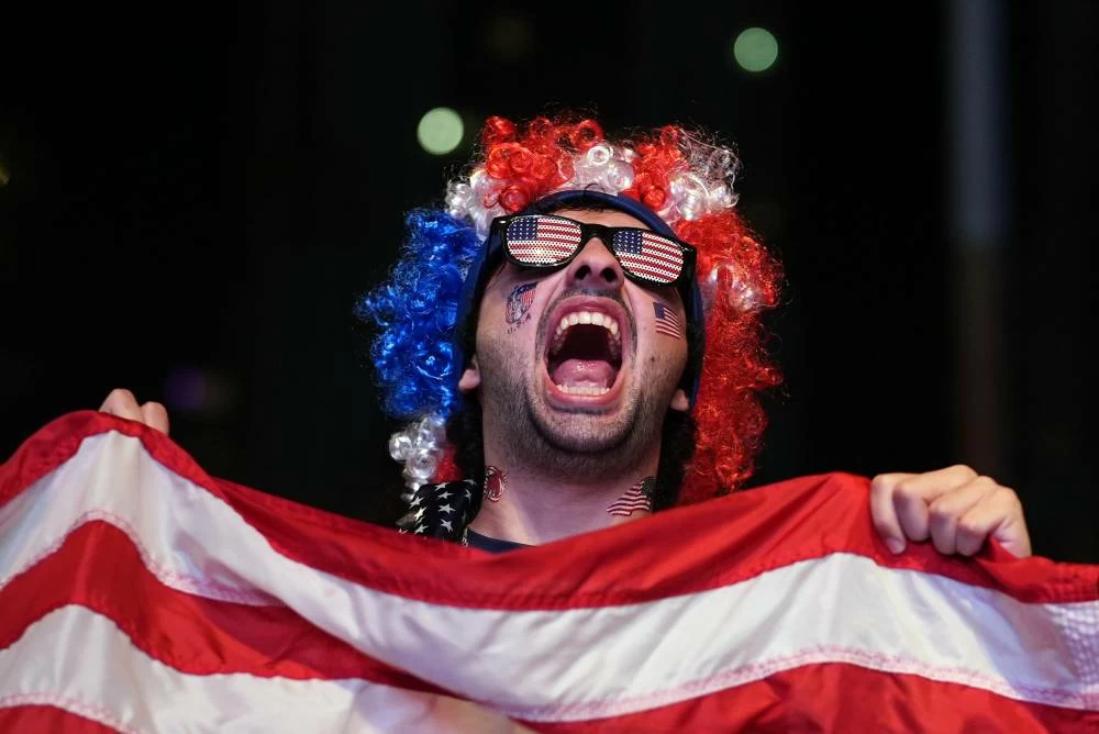 A U.S. soccer fan celebrates after the United States defeated Bosnia in their World Cup round of 32 soccer match, Wednesday, July 1, 2026, at an official fan fest in downtown Miami. Picture credit: AP