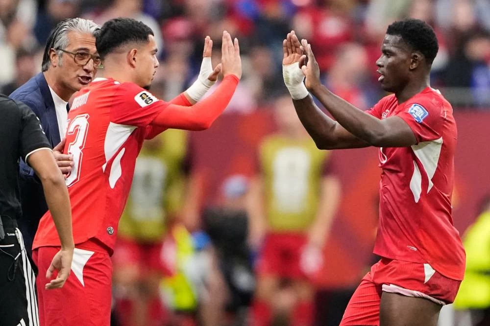 Switzerland's Zeki Amdouni (23) gestures to teammate Breel Embolo (7) as he takes the field during the World Cup round of 32 soccer match between Switzerland and Algeria in Vancouver, British Columbia, Thursday, July 2, 2026. (AP)