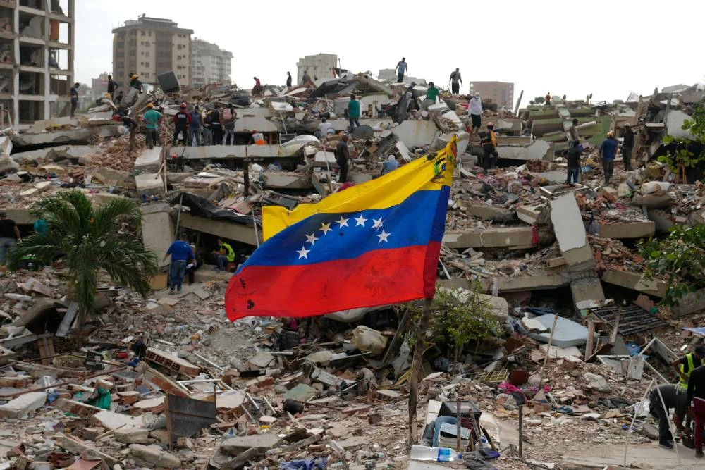 Residents and rescue workers search through the rubble of buildings damaged in the earthquakes that struck La Guaira, Venezuela, Thursday, July 2, 2026. (AP)