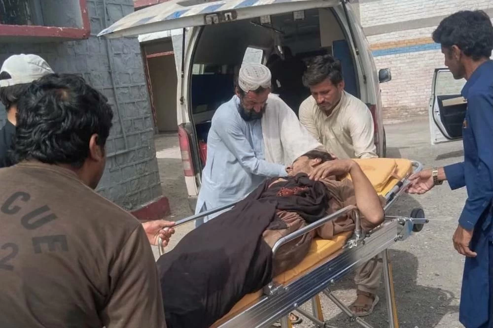 Rescue workers and volunteers transport an inured victim at a hospital after an overcrowded passenger bus plunged from a highway into a rocky ravine, in Dana Sar, a remote area near the border of Balochistan and Khyber Pakhtunkhwa provinces, in southwestern Pakistan, Friday, July 3, 2026. (AP)