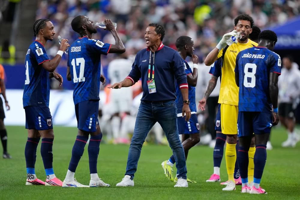 Cape Verde head coach Bubista speaks to players during a hydration break for the World Cup Group H soccer match between Cape Verde and Saudi Arabia in Houston, Friday, June 26, 2026. (AP)