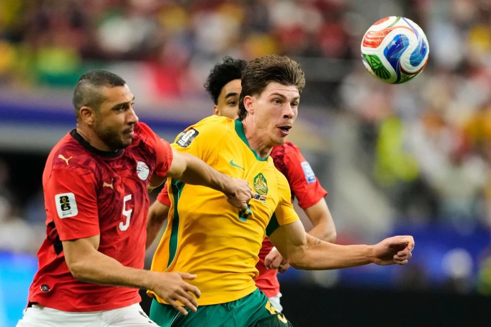 Egypt's Ramy Rabia, left, and Australia's Jordan Bos battle for the ball during the World Cup round of 32 soccer match in Arlington, Texas, near Dallas. Picture credit: AP