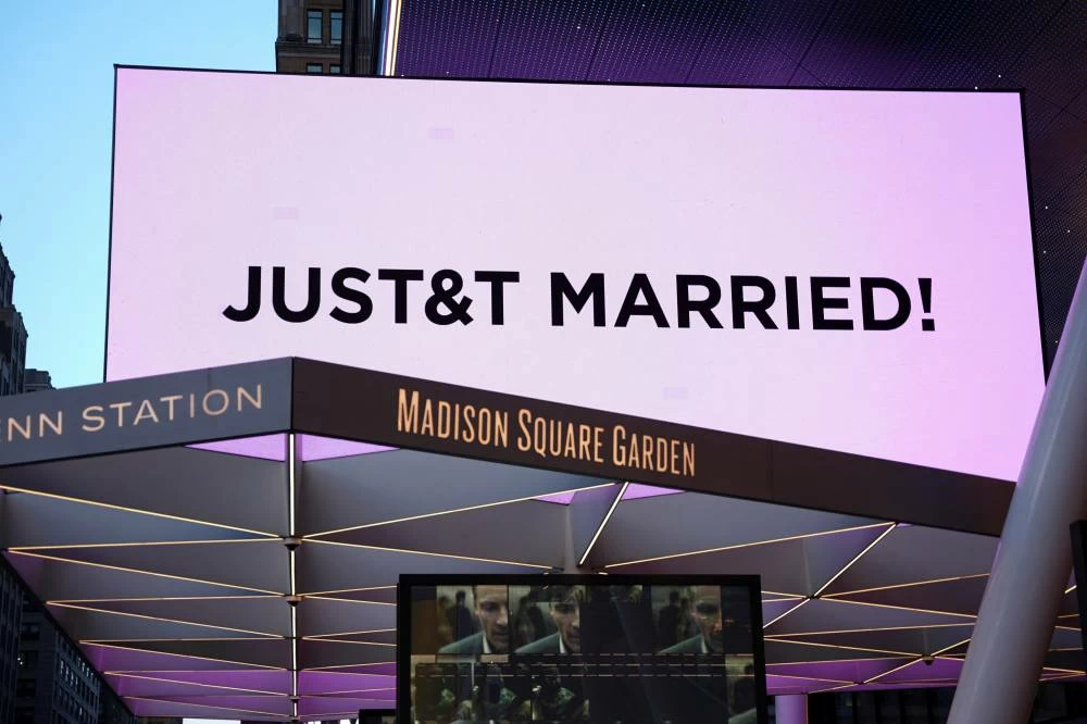 A screen displays a message referencing singer Taylor Swift and National Football League (NFL) player Travis Kelce outside Madison Square Garden, the venue for their reported wedding celebrations, in New York, U.S. Picture credit: Reuters