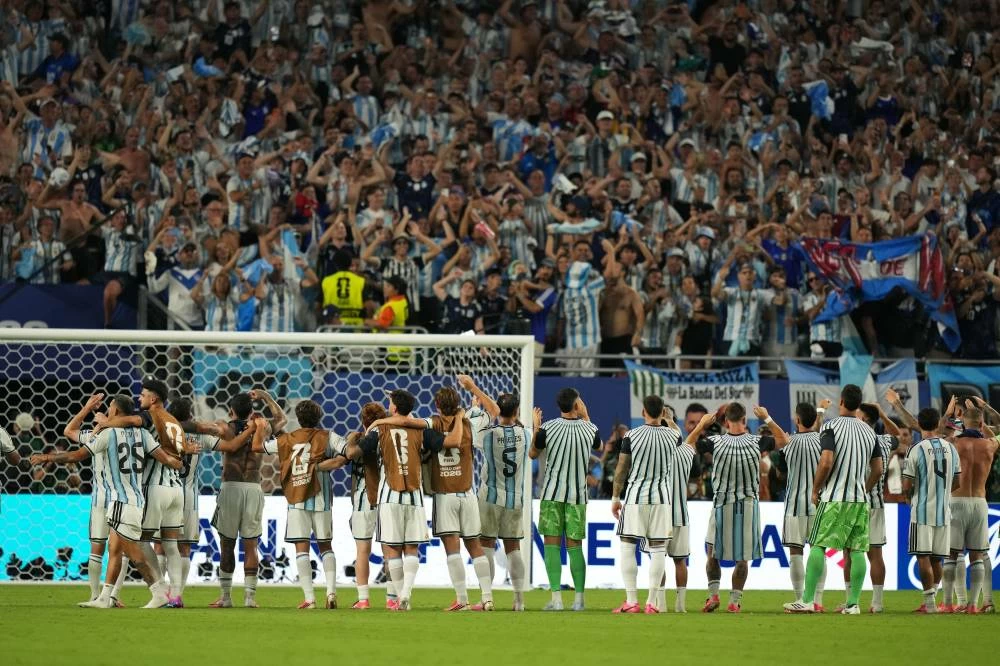 Players of Argentina react after the World Cup round of 32 soccer match against Cape Verde in Miami Gardens, Fla. Picture credit: AP