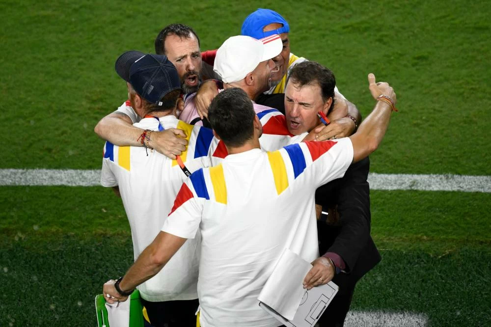 Colombia head coach Nestor Lorenzo, right, celebrates after the World Cup round of 32 soccer match between Colombia and Ghana in Kansas City, Mo., Friday, July 3, 2026. (AP)