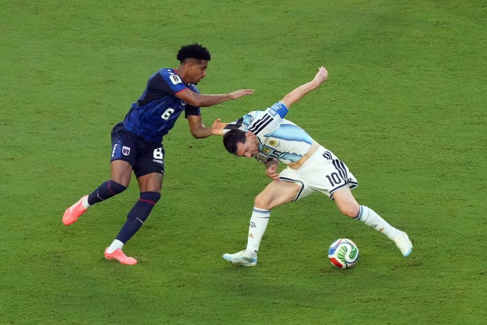 Lionel Messi (10) challenges for the ball with Cape Verde's Kevin Pina (6) during the World Cup round of 32 soccer match between Argentina and Cape Verde in Miami Gardens, Fla., Friday, July 3, 2026. (AP)
