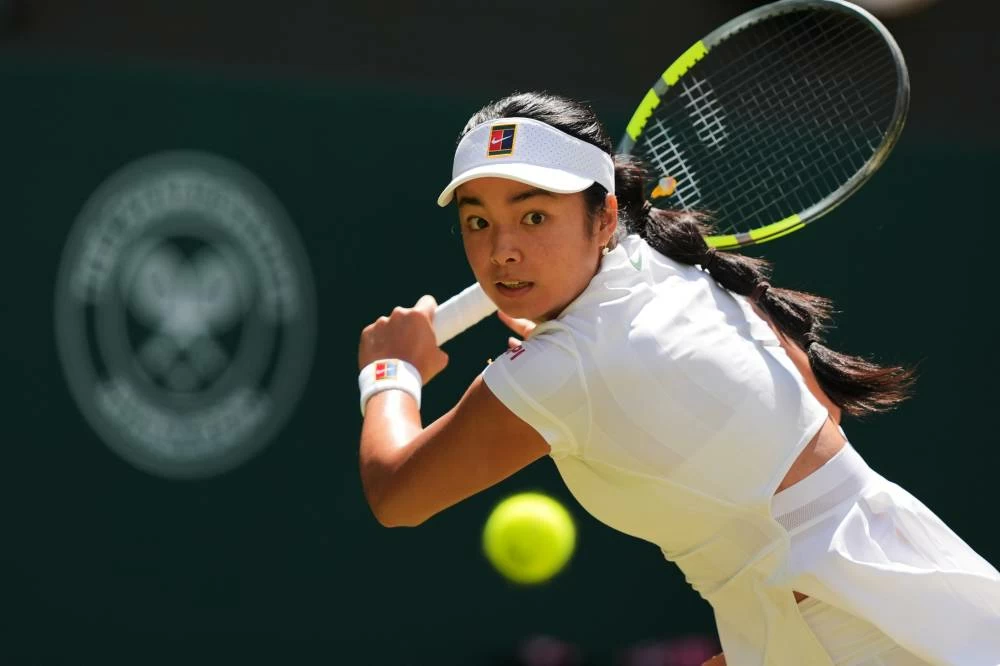 Alexandra Eala of the Philippines plays a return during the third round women's singles match against Iga Swiatek of Poland at the Wimbledon Tennis Championships in London, Saturday, July 4, 2026.(AP)