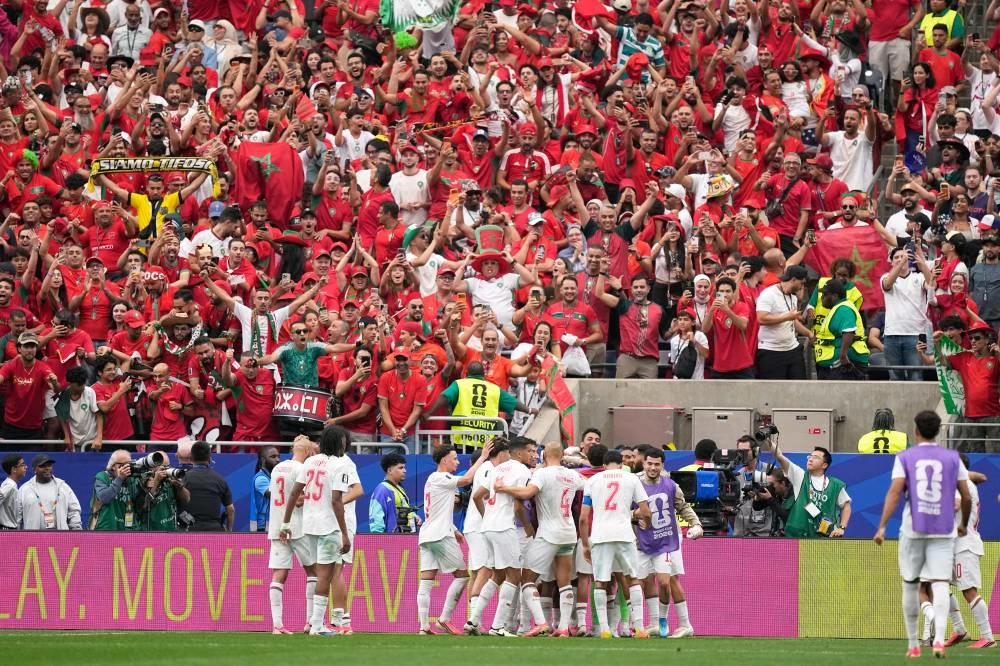 Morocco's players celebrate their 3-0 win after the World Cup round of 16 soccer match between Canada and Morocco in Houston, Saturday, July 4, 2026. (AP Photo/Ashley Landis)