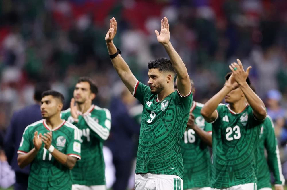 Mexico's Raul Jimenez looks dejected as he applauds fans with teammates after the match following their elimination from the World Cup REUTERS