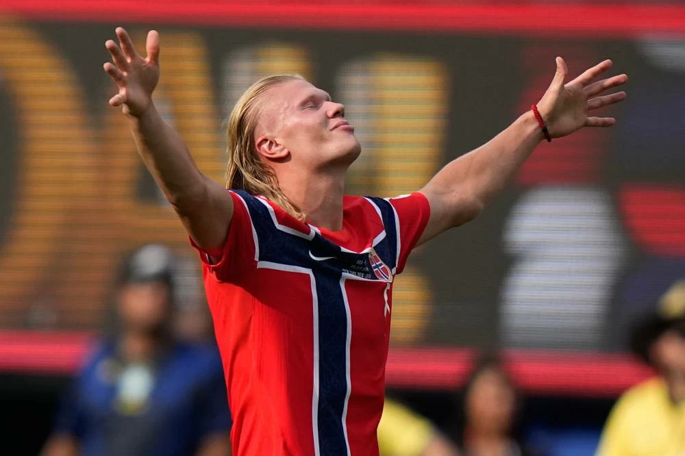 Norway's Erling Haaland (9) celebrates scoring his side's second goal during the World Cup round of 16 soccer match between Brazil and Norway in East Rutherford, N.J. Picture credit: AP