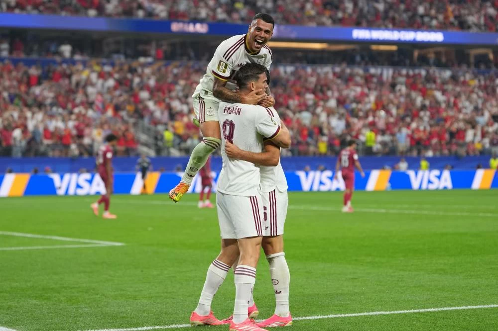 Spain's Pedro Porro, top, congrats Spain's Mikel Merino, right, after scored during the World Cup round of 16 soccer match between Portugal and Spain in Arlington, Texas, near Dallas. Picture credit: AP