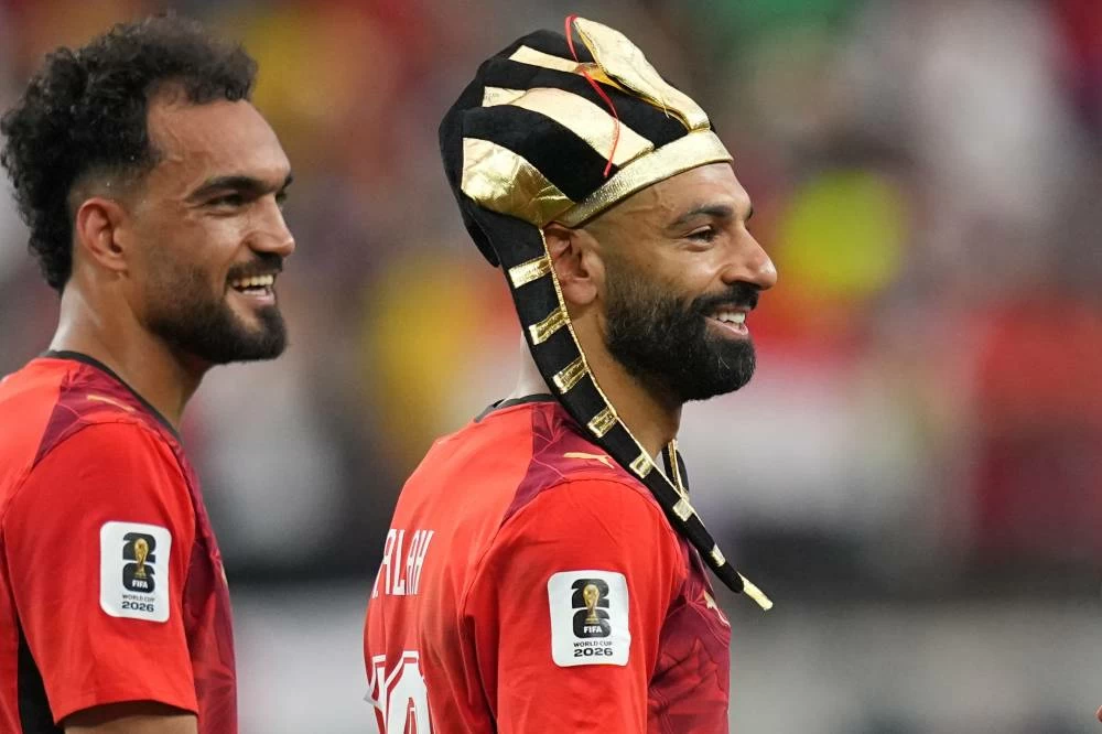 Egypt's Mohamed Salah, right, and teammate Mostafa Zico celebrate after winning a penalty shootout against Australia following a World Cup round of 32 soccer match in Arlington, Texas. Picture credit: AP