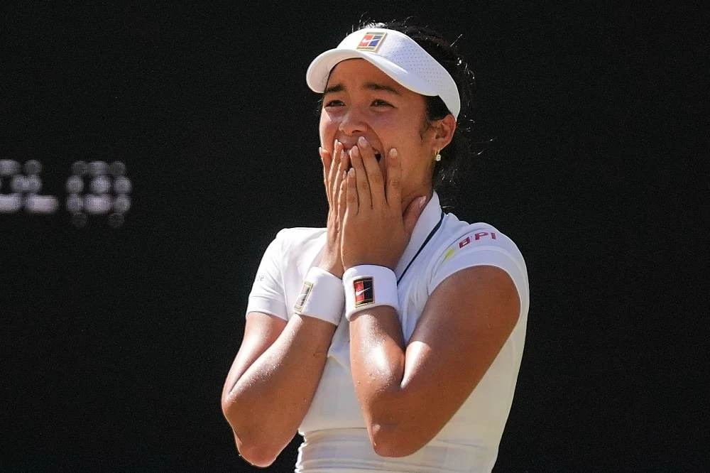 Alexandra Eala of the Philippines celebrates winning the third round women's singles match against Iga Swiatek of Poland at the Wimbledon Tennis Championships in London, Saturday, July 4, 2026.(AP)