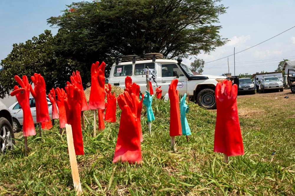 Rubber gloves are laid out on the ground outside the Rwampara General Hospital as healthcare workers involved in the Ebola response stage a go-slow over unpaid salaries, while authorities seek to contain a new outbreak of the Bundibugyo strain of Ebola in Rwampara, Ituri province, Democratic Republic of Congo, July 6, 2026. (Reuters)