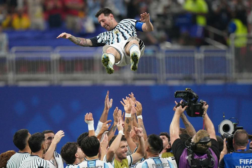 Argentina players toss teammate Lionel Messi into the air as they celebrate after the World Cup round of 16 soccer match between Argentina and Egypt in Atlanta, Tuesday, July 7, 2026. (AP)