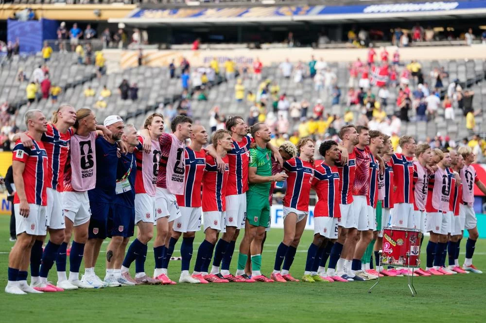 Norway players celebrate after the World Cup round of 16 soccer match between Brazil and Norway in East Rutherford, N.J. Picture credit: AP