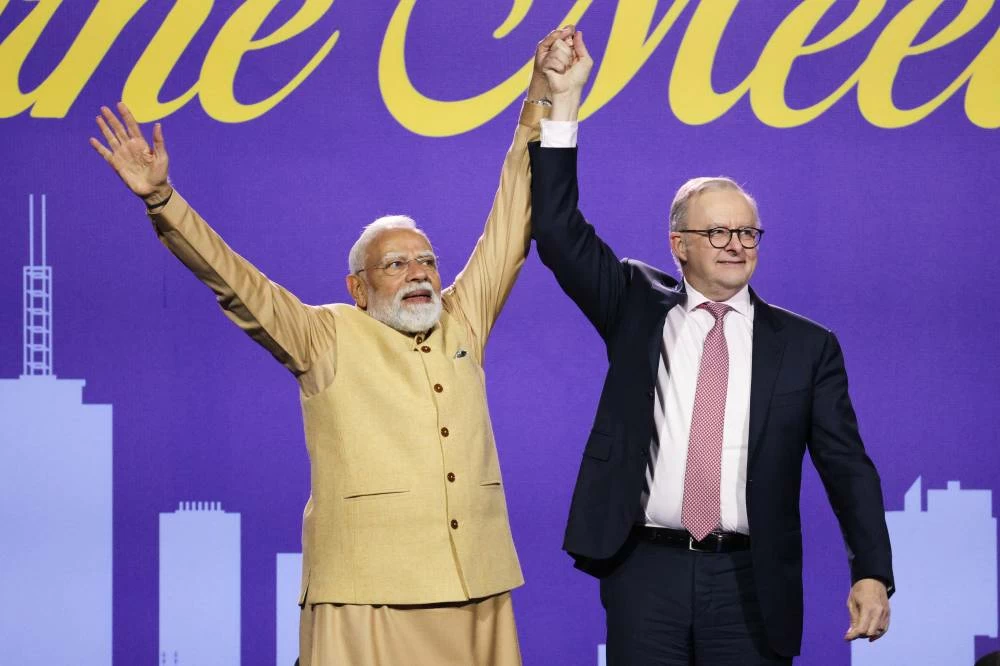 Indian Prime Minister Narendra Modi and Australian Prime Minister Anthony Albanese, right, react following their speeches during a community event in Melbourne, Australia, Thursday, July 9, 2026. (AP)