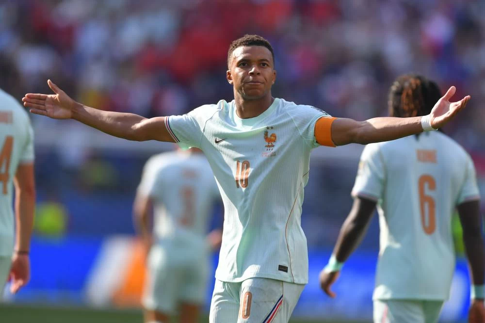 France's Kylian Mbappe (10) celebrates scoring the opening goal during the World Cup quarterfinal soccer match between France and Morocco in Foxborough, Mass. Picture credit: AP