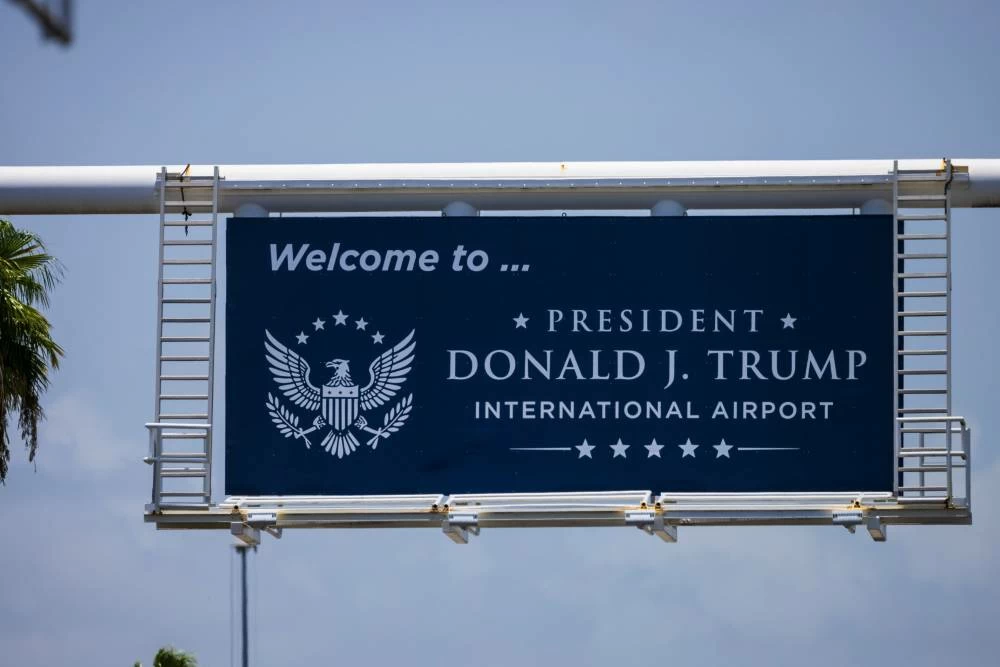 A sign displaying the name of the rebranded Donald J. Trump International Airport in West Palm Beach, Fla., is seen Thursday, July 9, 2026. (AP Photo/Saul Martinez)