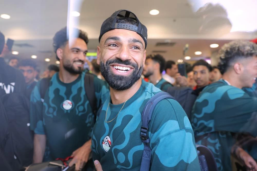 Mohamed Salah, smiles as he is greeted by fans upon the Egyptian national soccer team arrival at El-Alamein airport, 160 km (99 miles) west of Alexandria, Egypt. Picture credit: AP