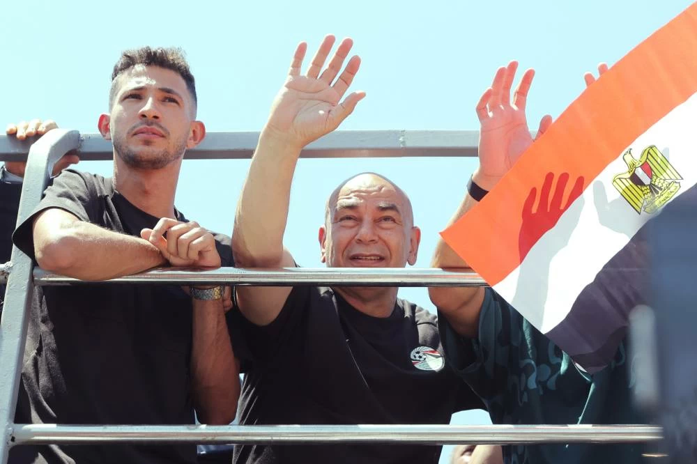 Egypt's Head coach Hossam Hassan greets fans upon the Egyptian national soccer team arrival at El-Alamein airport. Picture credit: AP