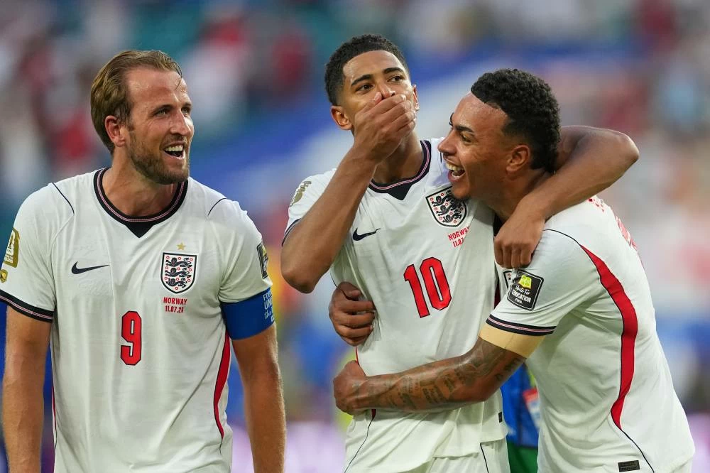 England's Harry Kane, left, Jude Bellingham, center, and Morgan Rogers celebrate defeating Norway in a World Cup quarterfinal soccer match in Miami Gardens. AP