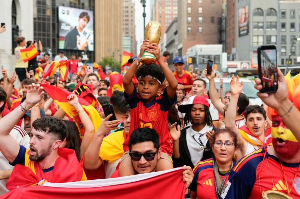 Spain fans gather for a rally on the eve of the World Cup final soccer match in New York's Times Square. AP