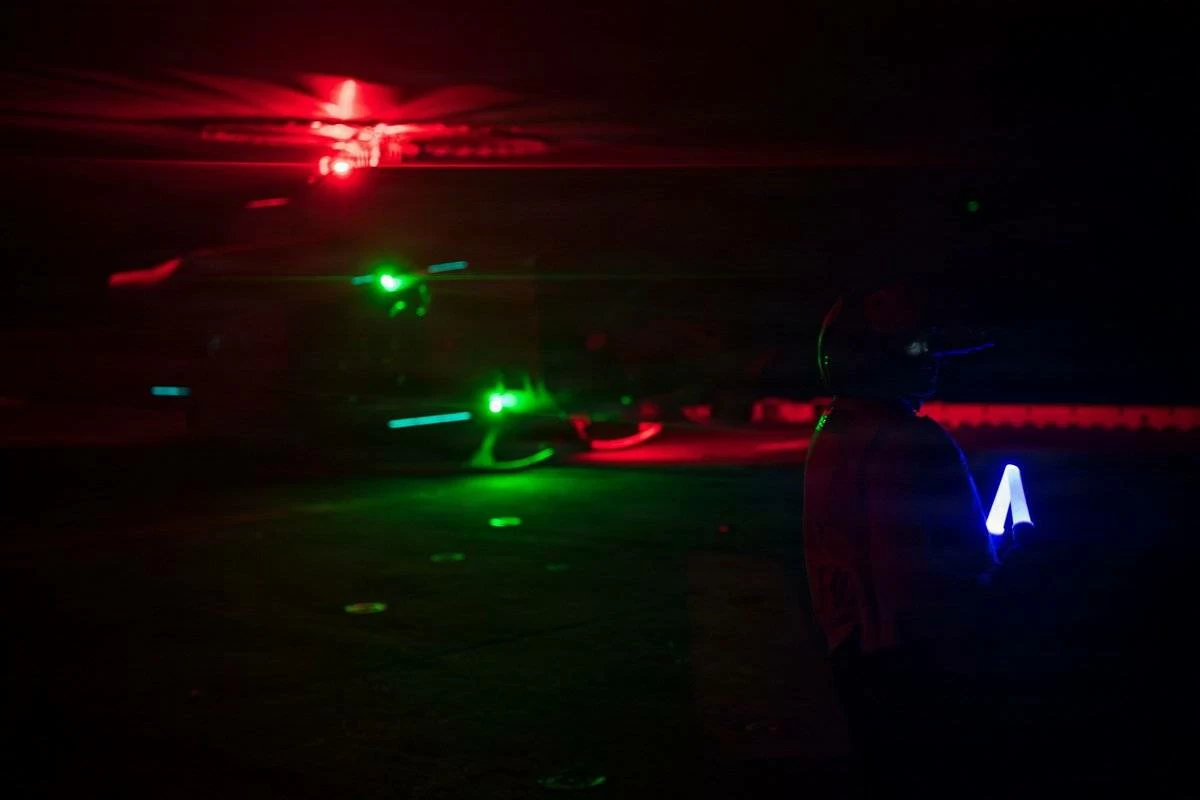 US service members aboard amphibious assault ship USS Boxer (LHD 4) support flight operations day and night from the Arabian Sea as CENTCOM enforces the naval blockade against Iran. @CENTCOM