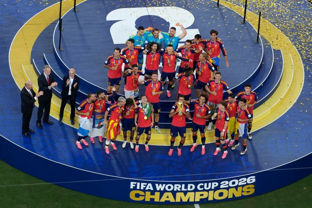 Spain players celebrate with the trophy after the World Cup final soccer match between Spain and Argentina in East Rutherford, N.J., near New York, Sunday, July 19, 2026. (AP)