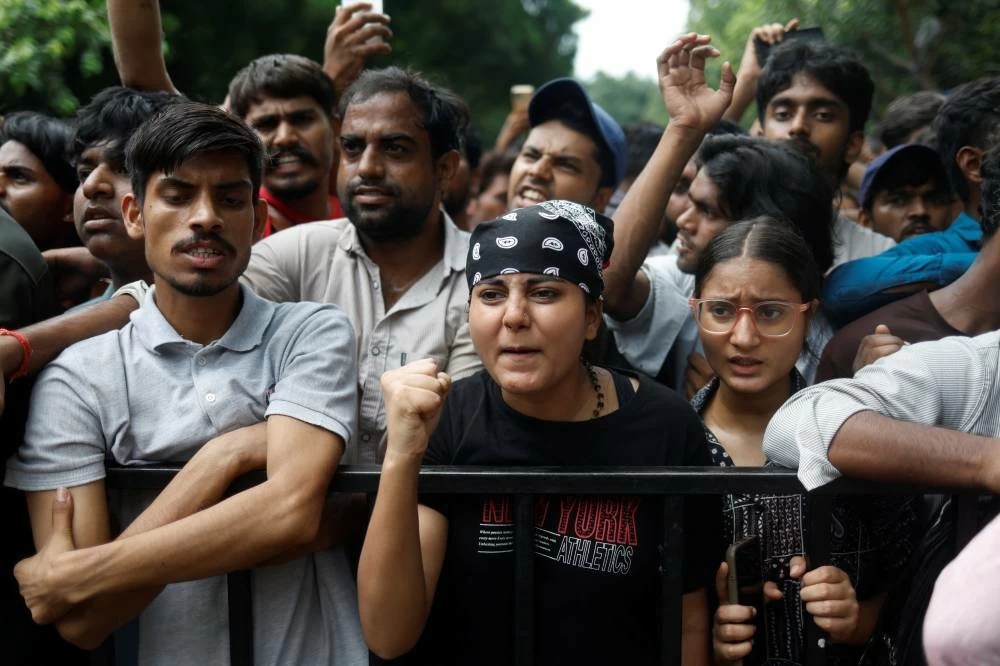 Supporters of India's Cockroach Janta Party (CJP) react at a protest site, a day after thousands of protesters marched toward parliament demanding the resignation of Education Minister Dharmendra Pradhan over examination paper leaks, at Jantar Mantar in New Delhi, India, July 21, 2026. Reuters