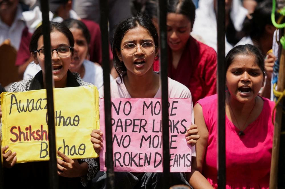 India's Cockroach Janata Party (CJP) supporters hold placards while chanting slogans during ongoing protests at Jantar Mantar in New Delhi, India, July 22, 2026. (Reuters)