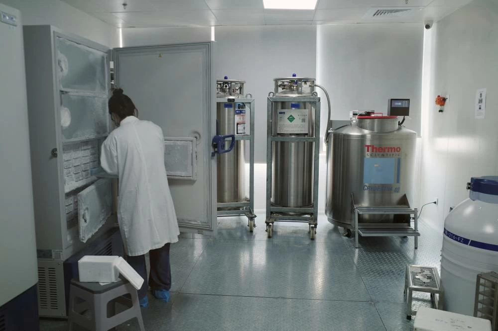 A lab technician retrieves biological samples from an ultra-low-temperature deep freezer at Insilico Medicine's research and development laboratory, in Shanghai, China, July 20, 2026. (Reuters)