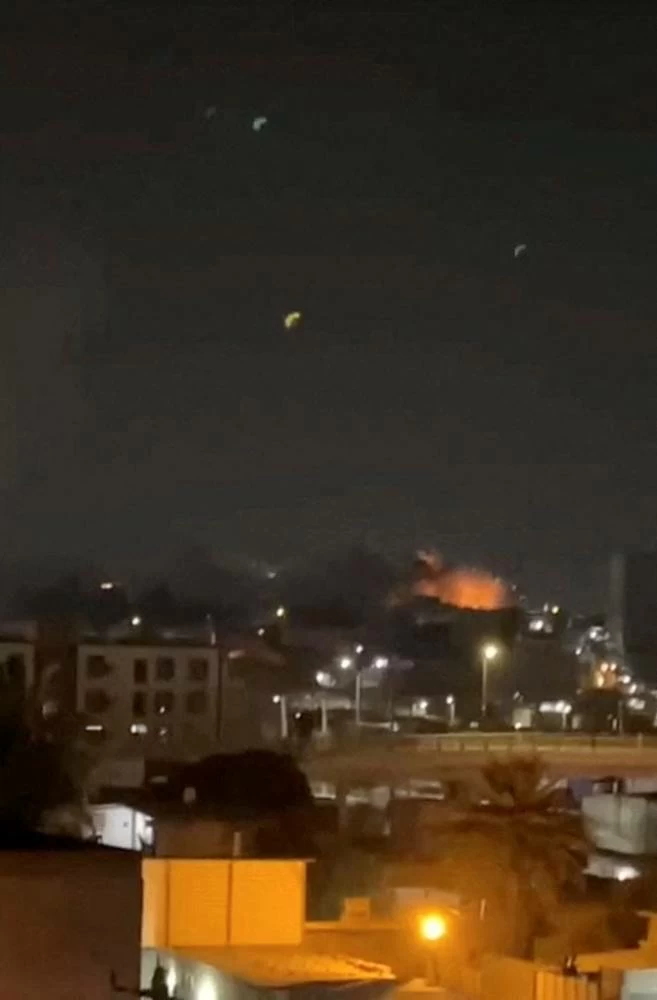 Smoke and flames rise after an explosion in Bandar Abbas, Hormozgan Province, Iran, July 24, 2026, in this screengrab obtained from a social media video. (Social Media/via Reuters)