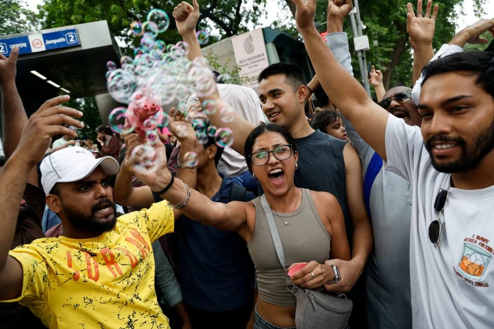 Supporters of India's Cockroach Janta Party (CJP) celebrate after India's Education Minister Dharmendra Pradhan resigned following days of protests demanding his resignation over National Eligibility cum Entrance Test (NEET) examination paper leaks, in New Delhi, India, July 25, 2026. REUTERS