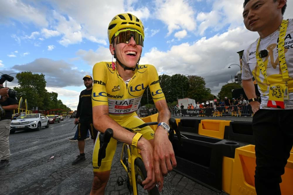Slovenia's Tadej Pogacar, wearing the overall leader's yellow jersey, reacts after the last stage of the Tour de France cycling race in Paris, Sunday, July 26, 2026. AP